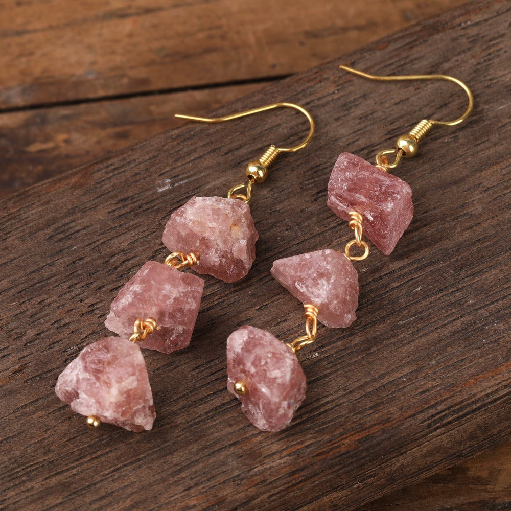 Experience the beauty of nature with Fiong Mma&#39;s Raw Crystal Earrings- A pair of our exquisitely designed Raw Crystal Earrings, handcrafted from a variety of 24 natural stones. Each earring showcases the unique textures and colors of the stones, offering a blend of fashion and natural beauty, and reflecting a deep connection to the Earth.