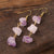 Experience the beauty of nature with Fiong Mma's Raw Crystal Earrings- A pair of our exquisitely designed Raw Crystal Earrings, handcrafted from a variety of 24 natural stones. Each earring showcases the unique textures and colors of the stones, offering a blend of fashion and natural beauty, and reflecting a deep connection to the Earth.