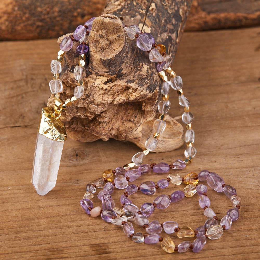 Experience the beauty of nature with Fiong Mma&#39;s Gemstone Necklace - a perfect gift for your loved ones! This handcrafted necklace features natural crystals and gemstones, such as amethyst, rose quartz, and turquoise, adding a touch of elegance and spirituality to any outfit. Each gemstone is thoughtfully selected for its unique energy and healing benefits, making it a meaningful gift for those seeking to enhance their spiritual journey.